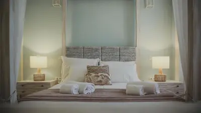 a bedroom with a large bed with two lamps at viterbo'8 - The Artists House in Porto