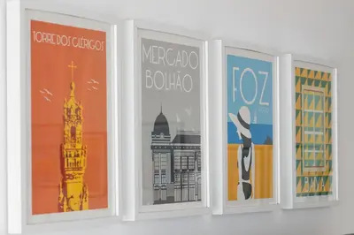 a group of three posters hanging on a wall at FLH Porto Spacious Apartment with Balcony in Porto