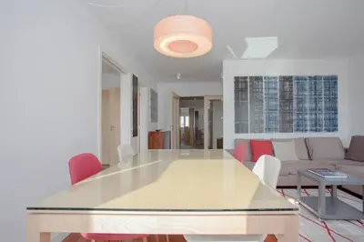 a living room with a table and a couch at Liiiving in Porto | Bright Light Apartment in Porto