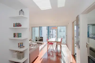 a kitchen and dining room with a view of the city at Liiiving in Porto | Bright Light Apartment in Porto