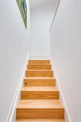 a staircase in a house with wooden floors at Almada Luxurious Duplex by DA'HOME in Porto