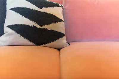 a cushion sitting on top of a couch at DA'HOME - Cedofeita Art Studio in Porto