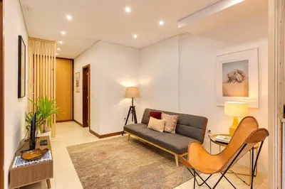 a living room with a couch and a table at DA'HOME - Marquês Unique Terraza in Porto