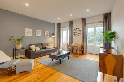 a living room with a couch and a table at DA'HOME - Vitoria Duplex Apartment in Porto