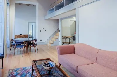 a living room with a couch and a table at BOUTIQUE Rentals - Toledos One & Only Apt in Historical center of Porto in Porto
