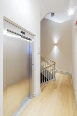 a hallway with a glass door and a staircase at BOUTIQUE Rentals - Toledos One & Only Apt in Historical center of Porto in Porto