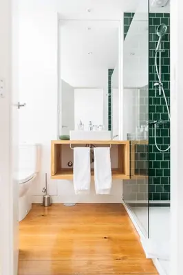 a bathroom with a sink and a shower at O da Joana in Porto