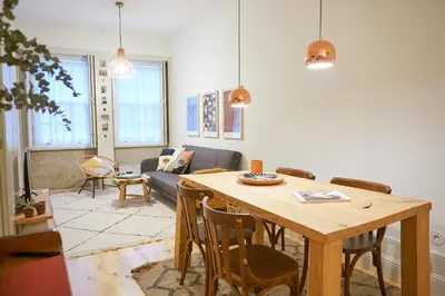a living room with a table and a couch at Host Wise - UNIK Porto Apartment in Porto