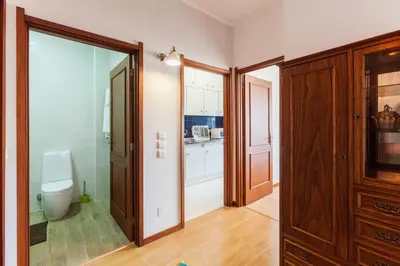 a bathroom with a toilet and a sliding glass door at Casa do Antonio in Porto