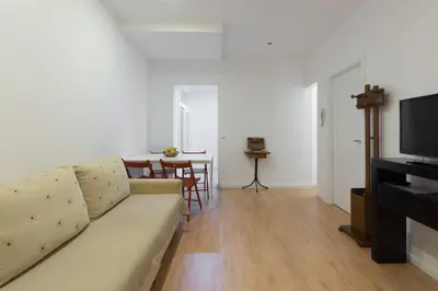 a living room with a couch and a table at Porto Belomonte Flats in Porto