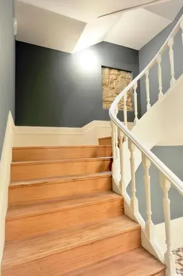 a staircase in a home with wood floors at FLH Almada Cozy Apartment with View in Porto