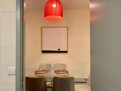 a dining room with a table and two chairs at RIBEIRA CHARMING APARTMENTS in Porto