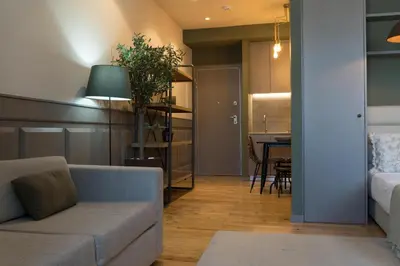a living room with a couch and a table at Olive Nature – Tourism Apartments in Porto