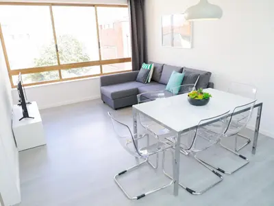a living room with a table and a couch at CM VINTAGE Apartments - Breiner in Porto