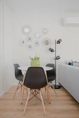 a dining room with a table and four chairs at Liiiving in Porto I Bright Light Studio in Porto
