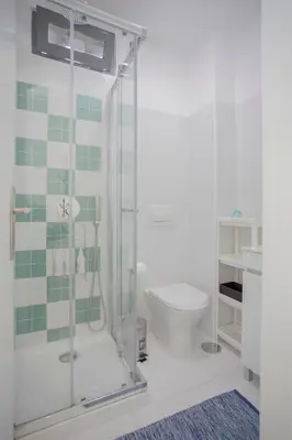 a bathroom with a shower and a toilet at Liiiving in Porto I Bright Light Studio in Porto