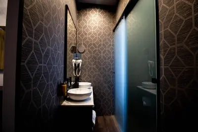 a bathroom with a sink and a mirror at Rubens Hotels & SPA in Vila Nova de Gaia