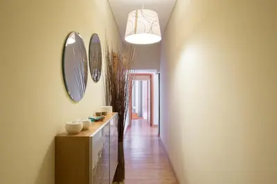 a hallway with a vanity and mirrors on the wall at OPO 52 in Porto