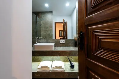 a bathroom with a sink and a mirror at Porto Premium River View I in Porto