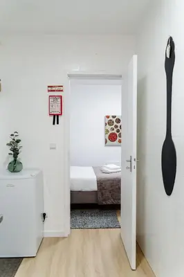 a room with a door open to a bedroom with a bed at River Flat I - Heart of Porto in Porto