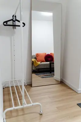 a living room with a couch and a mirror at River Flat I - Heart of Porto in Porto