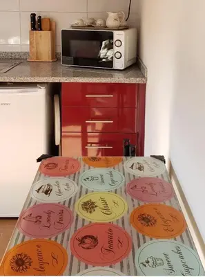 a table with colorful frisbees on it in a kitchen at D'OURO DONA MARIA By LW in Vila Nova de Gaia