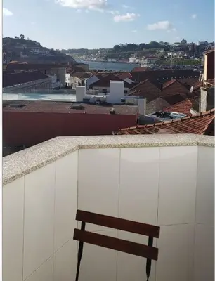 a wooden bench sitting on top of a building at D'OURO DOM LUÍS By LW in Vila Nova de Gaia