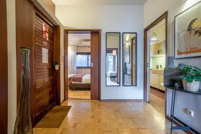 a hallway with a door leading to a bedroom at Firmeza388 Charming Flats - Comfort & Privacy with 2 Bedrooms in Porto