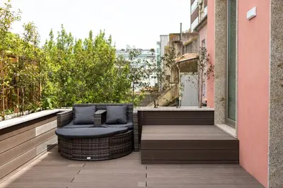 a living room with a couch and a fireplace at Porto Deluxe Apartments in Porto