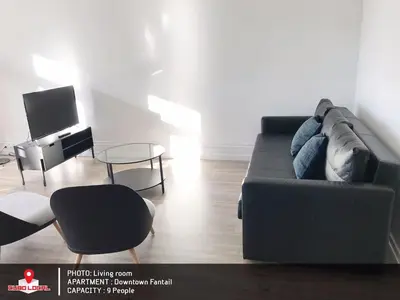 a living room with a couch and a table at Downtown Fantail in Porto