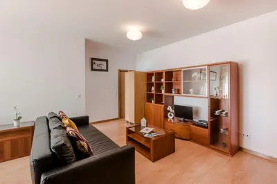 a living room with a couch and a coffee table at Porto City Experience in Porto
