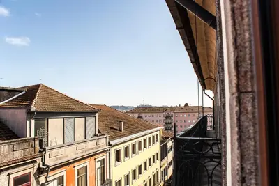 a view of a city from a window at Baixa24 •P3R• Super estúdio no centro histórico in Porto