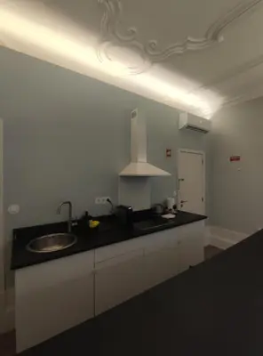 a kitchen with a sink and a counter top at Baixa24 •P1R• Brand New Apt in the Historic Center in Porto