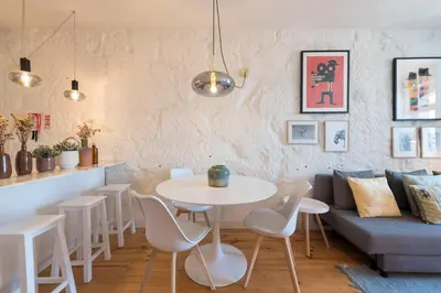 a living room with a table and a couch at Cativo Apartment - Porto Downtown in Porto