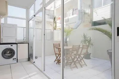a glass shower door in a bathroom with at Liiiving in Porto - Terrace Downtown Apartment in Porto