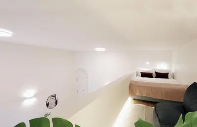 a white room with a bed and a couch at HM - Oporto Cedofeita 500C in Porto
