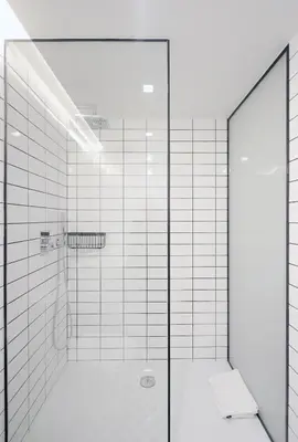 a shower with a glass door in a bathroom at HM - Oporto Cedofeita 500E in Porto