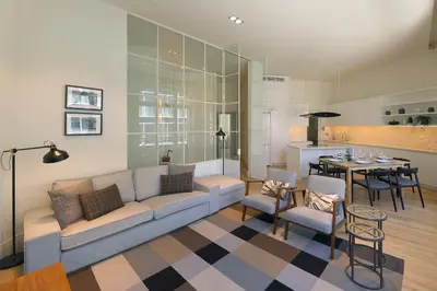 a living room with a couch and a table at FLH Sá da Bandeira Luxury Apartment in Porto
