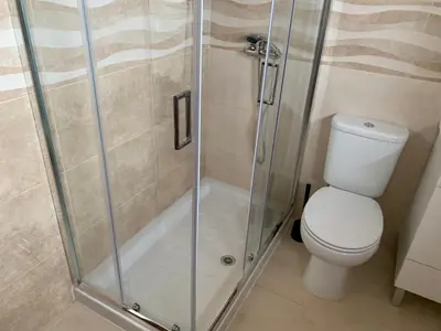 a bathroom with a shower and a toilet at Invicta House Loft Boavista in Porto