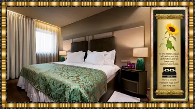 a hotel room with a bed with a green blanket at Hotel Jaguar Oporto - is Near the Metro has Free Parking and a Free Shuttle Service between the Airport and the Hotel from 7AM to 8PM in Porto