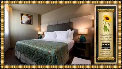 a hotel room with a bed with a green blanket at Hotel Jaguar Oporto - is Near the Metro has Free Parking and a Free Shuttle Service between the Airport and the Hotel from 7AM to 8PM in Porto