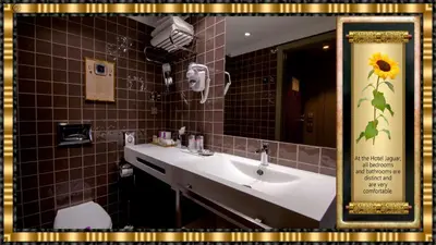 a bathroom with a sink and a mirror at Hotel Jaguar Oporto - is Near the Metro has Free Parking and a Free Shuttle Service between the Airport and the Hotel from 7AM to 8PM in Porto