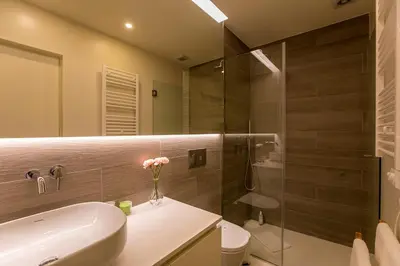a bathroom with a toilet and a sink and a shower at Casa São Lázaro- Terrace by Oporto Soul in Porto