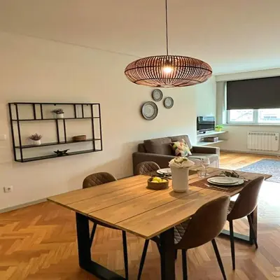 a living room with a table and a couch at bnapartments Trindade in Porto
