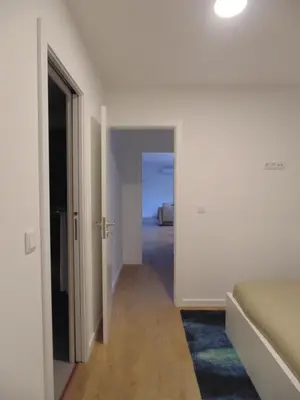 an empty room with a bed and a hallway at Dream Modern House in Porto