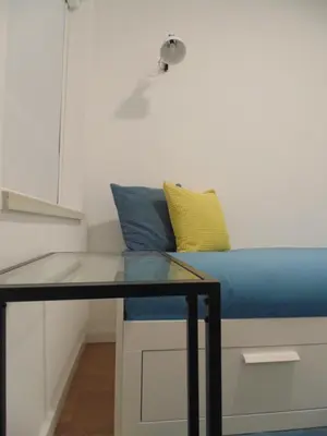 a bed in a room with a glass table at Dream Modern House in Porto