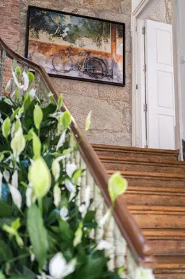 a painting of a bicycle on a wall next to stairs at D'Autor Apartments Alegria in Porto