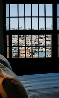 a bathroom with a toilet and a sink and a shower at Exmo Hotel by Olivia in Porto