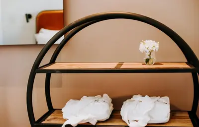 a bedroom with a bed and a table with a chair at Exmo Hotel by Olivia in Porto