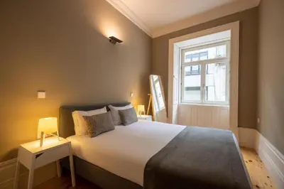 a bedroom with a large bed and a window at MyStay Porto - Urban Collection in Porto